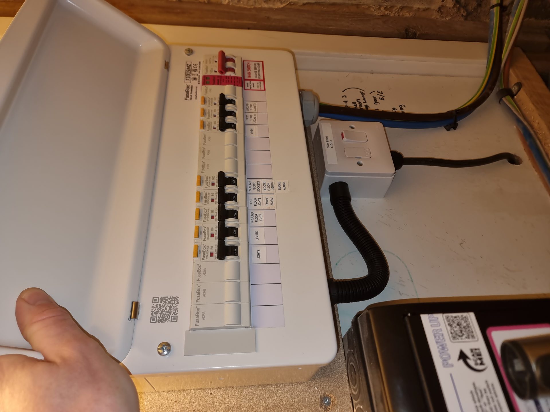 Professional electrician inspecting electrical panel